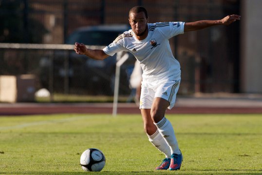 Huddersfield Town have signed Swansea City defender Jazz Richards on an emergency loan.