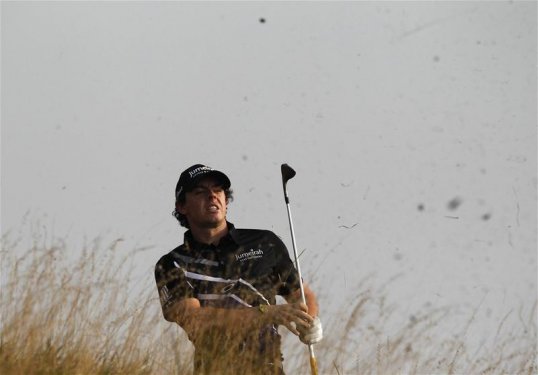 Rory McIlroy scored 65, seven under par, to move into second place in round two of the BMW Masters in Shanghai.