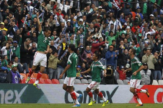 Mexico have moved a step closer to securing their spot at next summer’s World Cup finals in Brazil after a comfortable victory over New Zealand in the first leg of their intercontinental play-off.