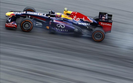 Sebastian Vettel described his Red Bull teammate Mark Webber as too slow and told the pit wall to get him out the way at the front of the Malaysian Grand Prix.