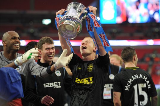 Ahead of the Community Shield, SportsDirect News digs through the archives to investigate Wigan Athletic's fairytale rise from non-league no-hopers to FA Cup winners.