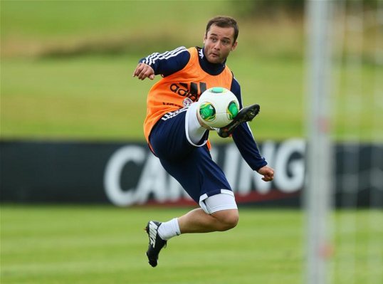 Wigan Athletic star Shaun Maloney is going to see a specialist about a back problem - as he feels the strain of club and country commitments.