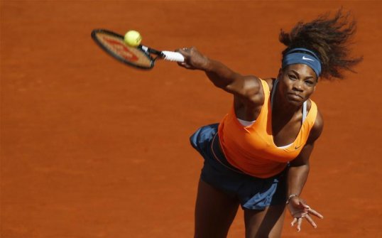 World number one Serena Williams survived a second set whitewash by Anabel Medina Garrigues to battle her way into the semi-finals of the Madrid Masters.