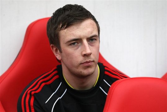 Liverpool defender Danny Wilson has completed a season-long loan to Heart of Midlothian.