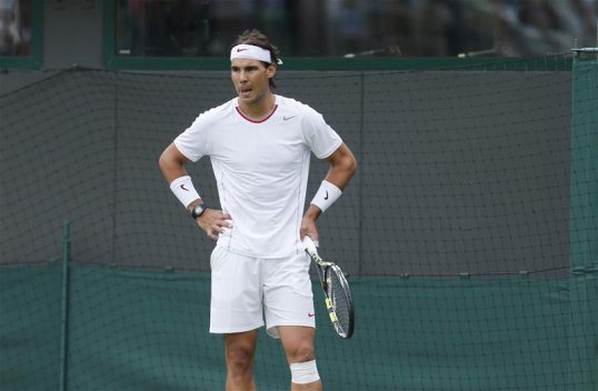 Rafael Nadal is out of Wimbledon after losing 7-6, 7-6, 6-4 to world number 135 Steve Darcis in the first round.