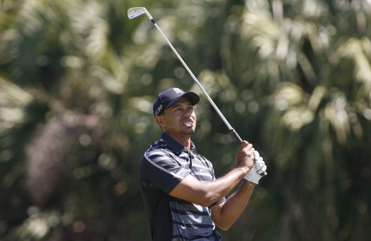 Tiger Woods is one of five players tied for the lead on six-under par after the first round of the WGC-Cadillac Championship.