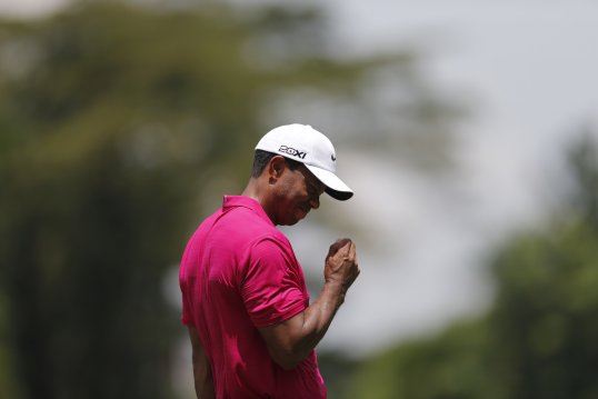 Tiger Woods lost ground in his hunt for the CIMB title.