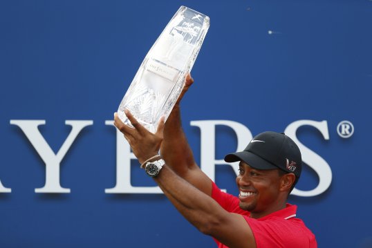 A late collapse from Sergio Garcia allowed Tiger Woods to claim a two-shot victory at the Players Championship on Sunday.
