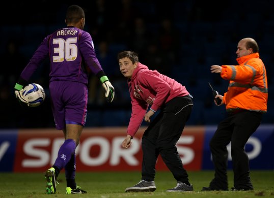 Wycombe Wanderers goalkeeper Jordan Archer was attacked by a fan in the closing stages of his side’s 1-0 win over Gillingham last night.