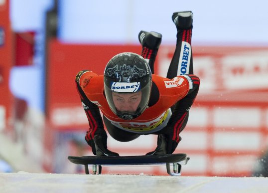 Lizzy Yarnold has clinched bronze in the latest Skeleton World Cup event in Whistler.